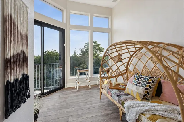 a bedroom with a bed and a window with outer view