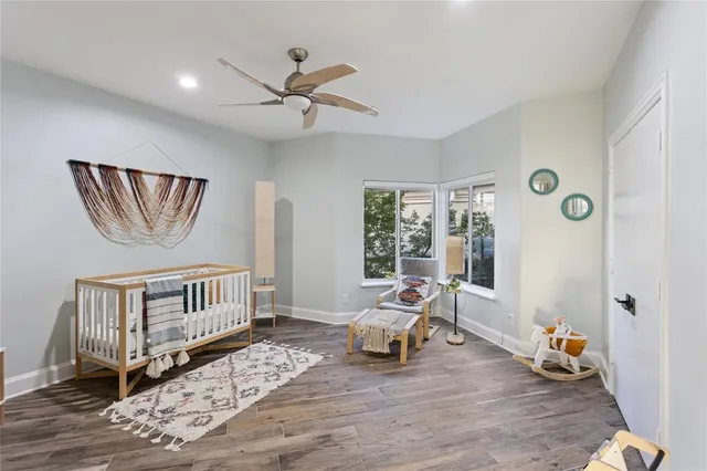 a bedroom with furniture and a window