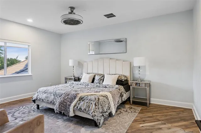 a bedroom with a bed and a table in it