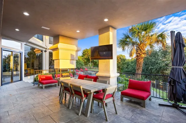 a patio with table and chairs