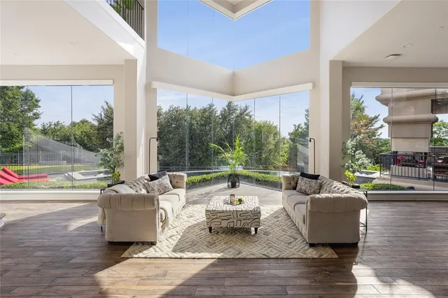 a living room with couch and a large window