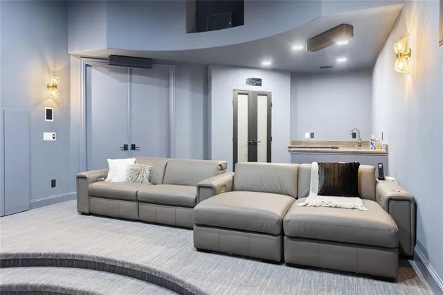 a living room with furniture and a mirror