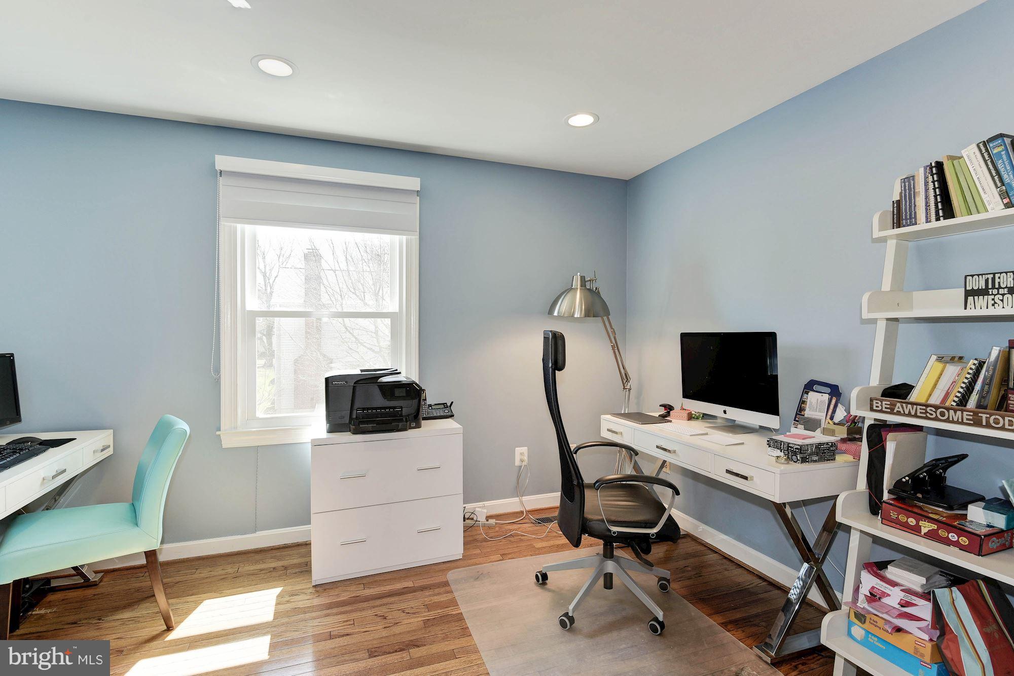 1304 19th Road South Arlington, VA 22202 - Photo 18 of 25 a view of a workspace with furniture and a window