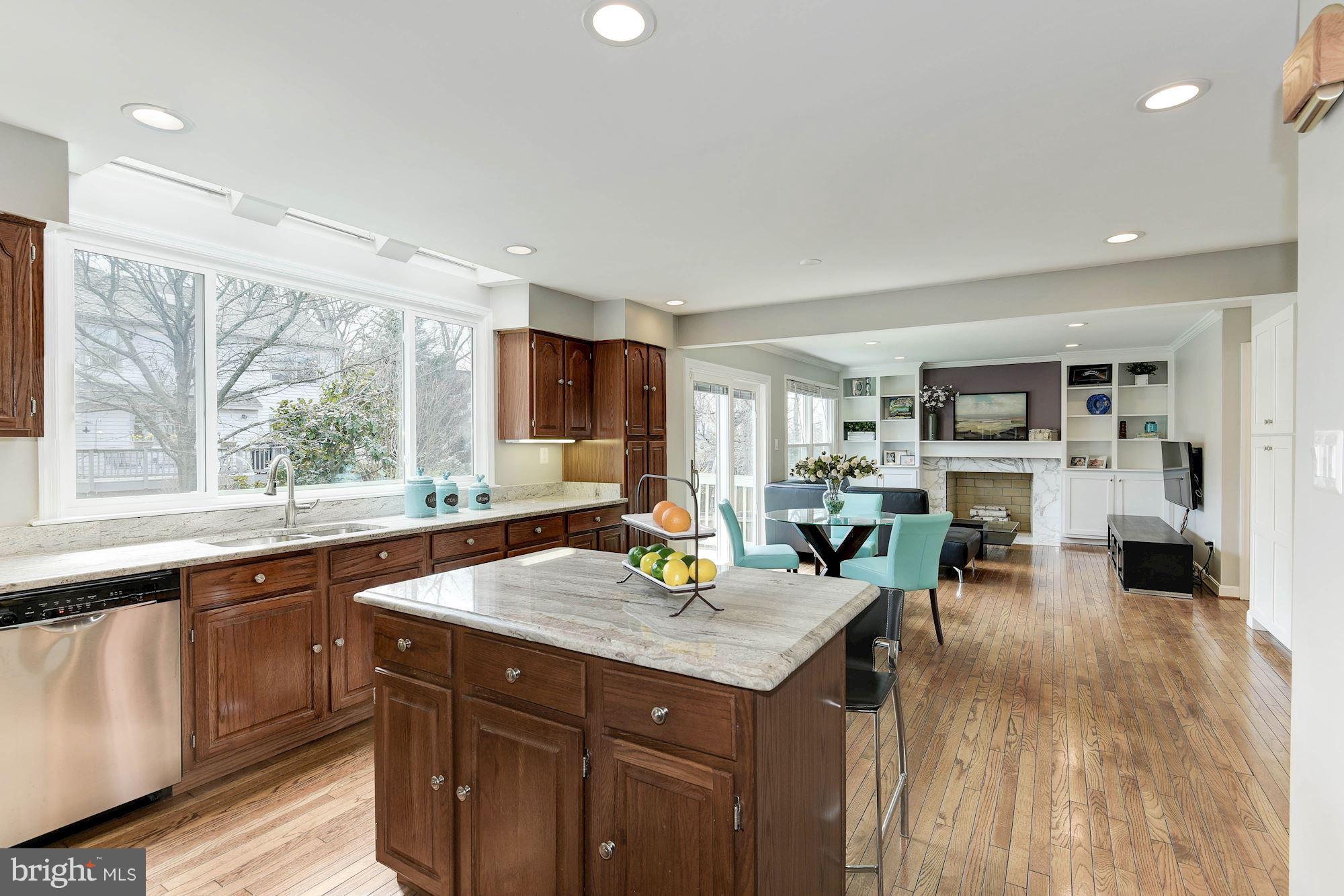 1304 19th Road South Arlington, VA 22202 - Photo 9 of 25 a kitchen with sink cabinets and wooden floor