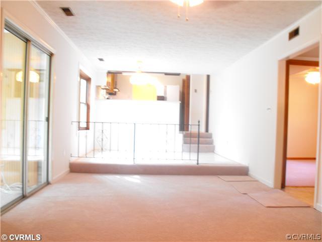 4641 Treely Road Chester, VA 23831 - Photo 5 of 11 a view of an empty room with a window