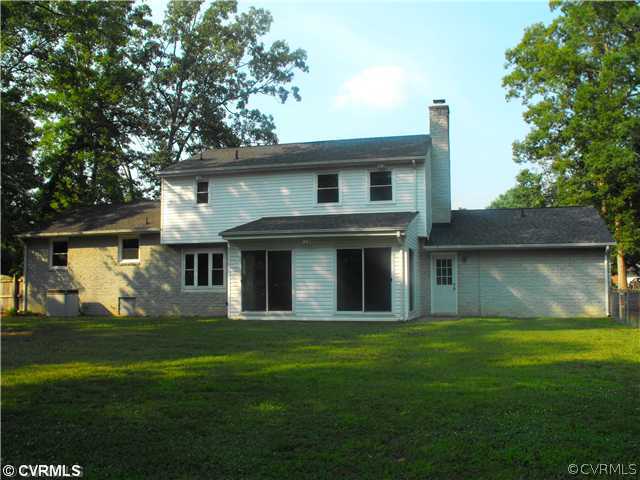 4641 Treely Road Chester, VA 23831 - Photo 8 of 11 a front view of a house with a garden