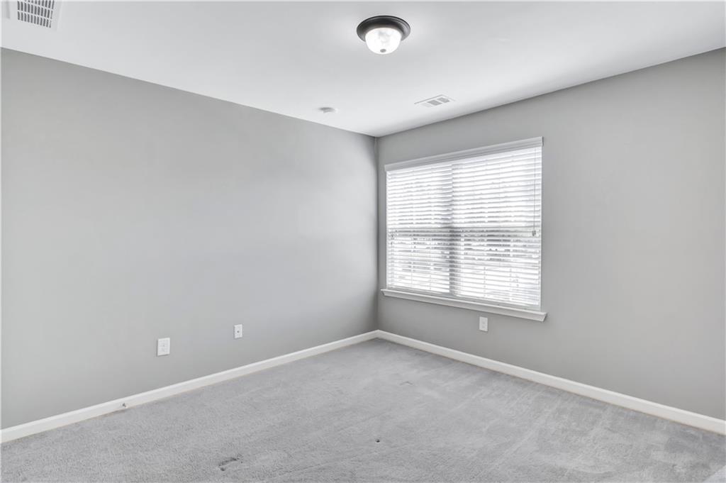 330 Avalon Square Fairburn, GA 30213 - Photo 37 of 52 an empty room with a window