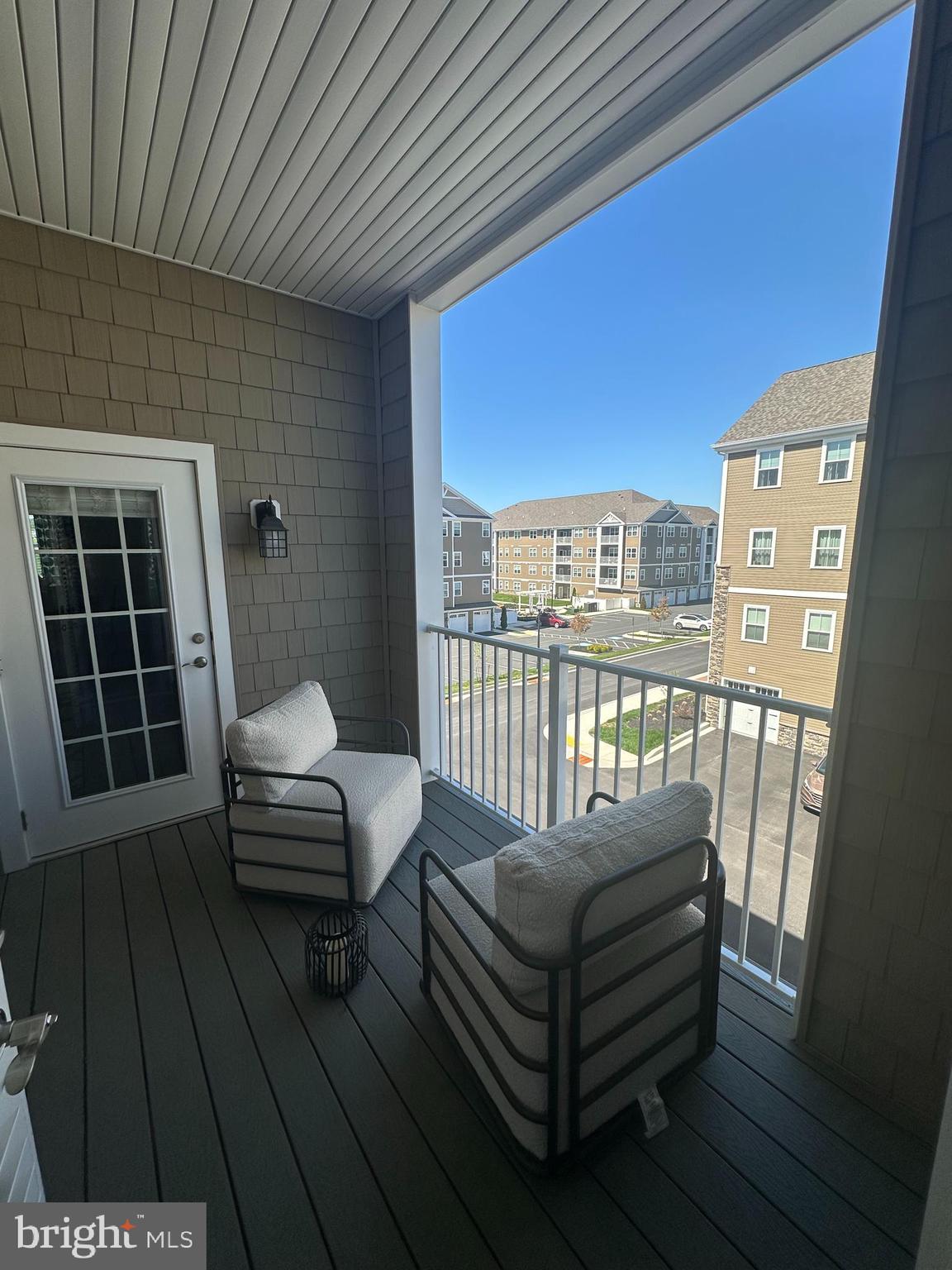 402 Bold Ruler Court, Unit 202 Havre de Grace, MD 21078 - Photo 11 of 17 a balcony with a couch
