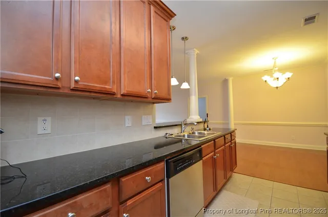 a kitchen with stainless steel appliances a sink and cabinets