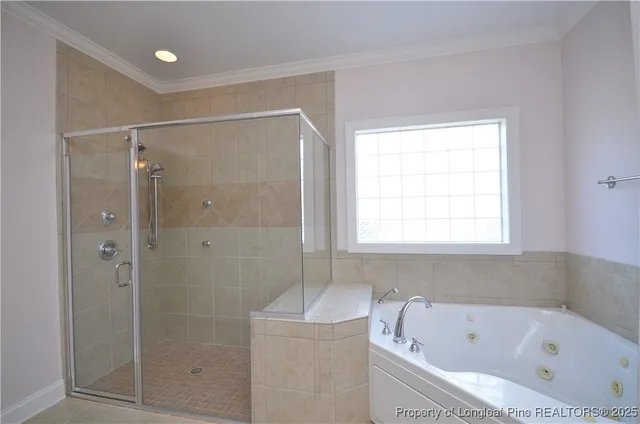 a bathroom with a bathtub a sink and a mirror