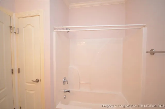 a balcony with table and chairs