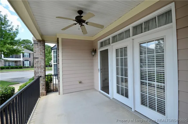 a view of a house with pool and chairs