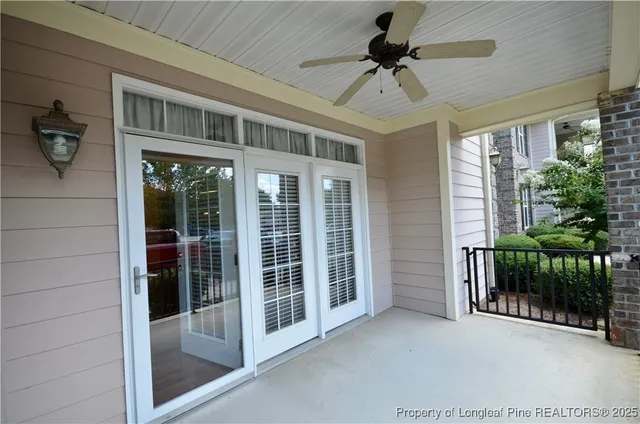 a front view of a house with a garden and trees