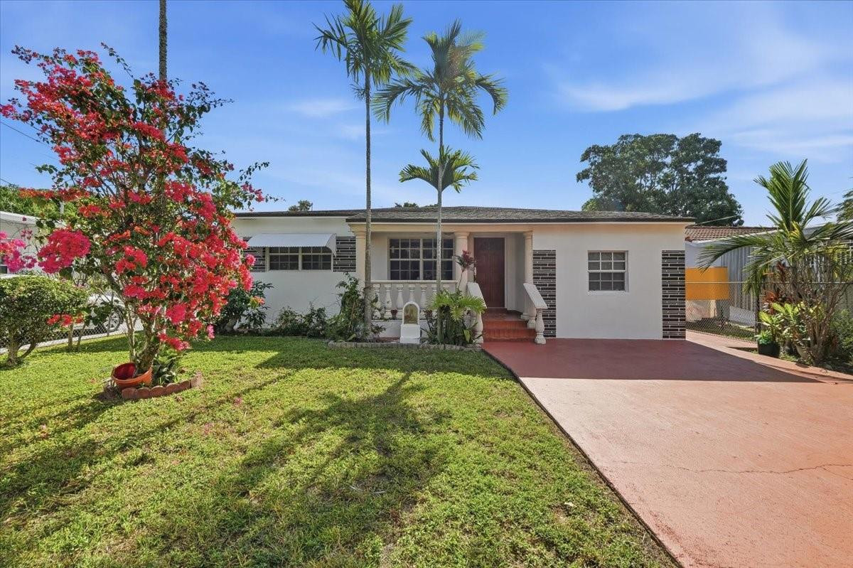 front view of a house with a yard