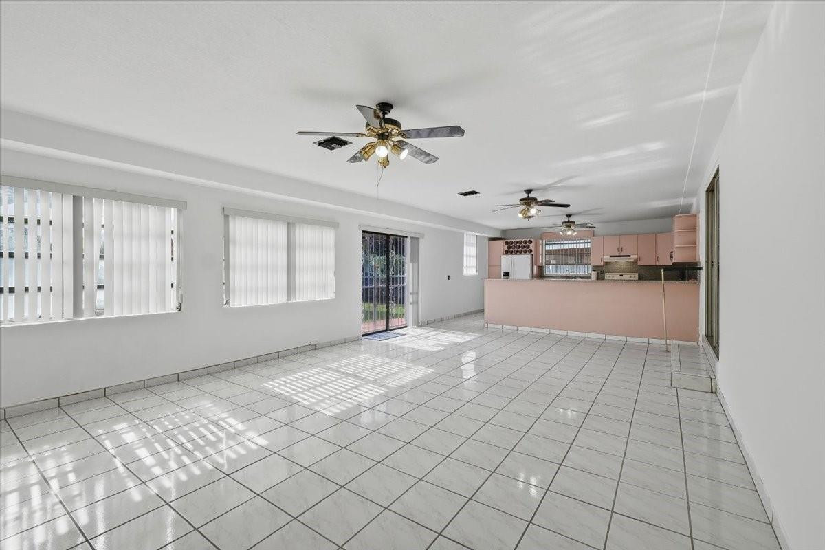 5580 Southwest 2nd Street Miami, FL 33134 - Photo 14 of 29 a view of a livingroom with furniture and chandelier fan