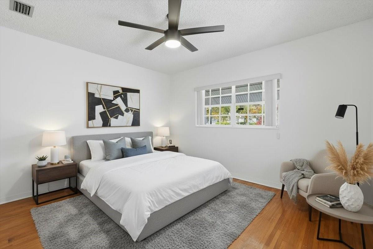 5580 Southwest 2nd Street Miami, FL 33134 - Photo 20 of 29 a bedroom with a bed and wooden floor