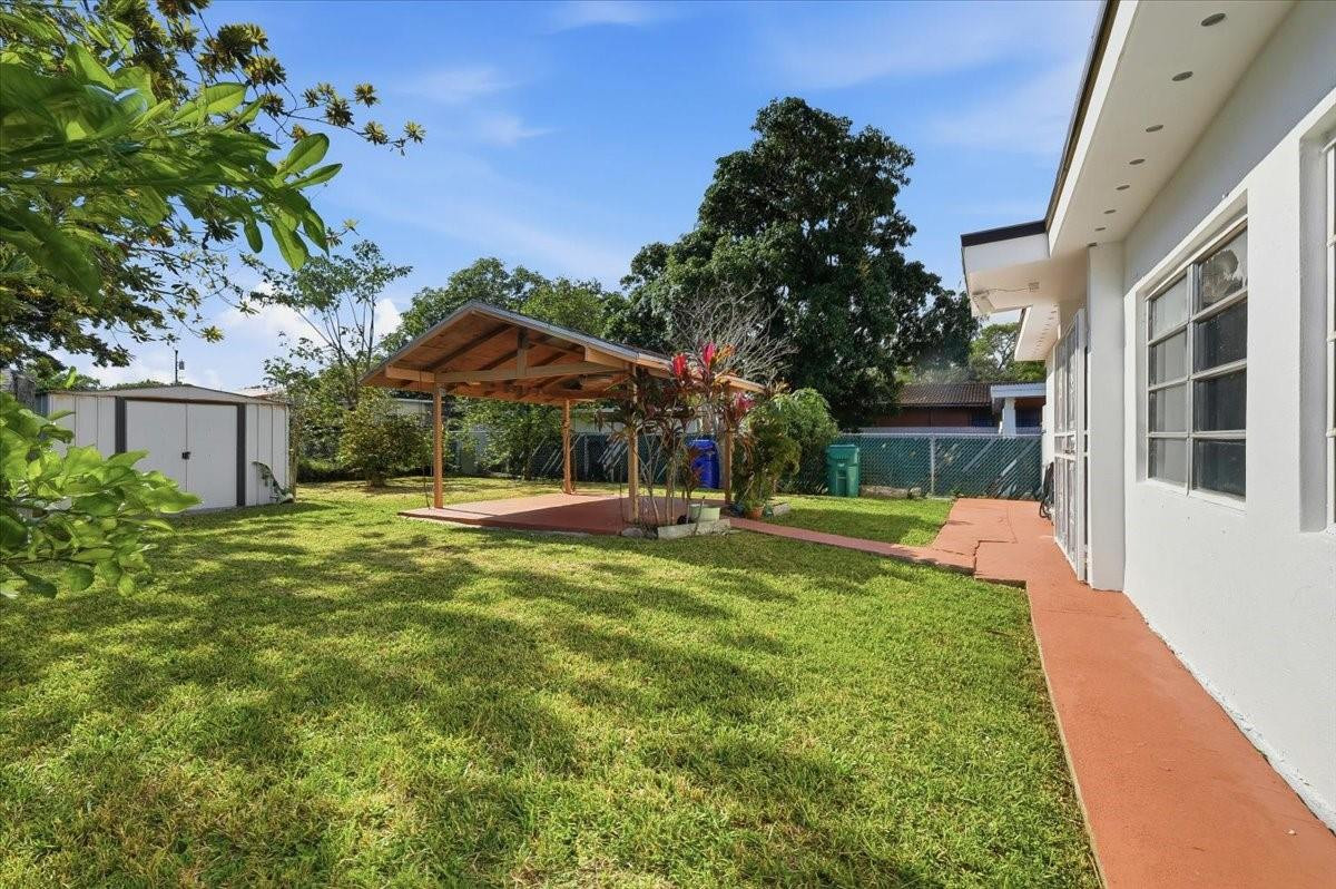 5580 Southwest 2nd Street Miami, FL 33134 - Photo 22 of 29 a view of a house with a yard