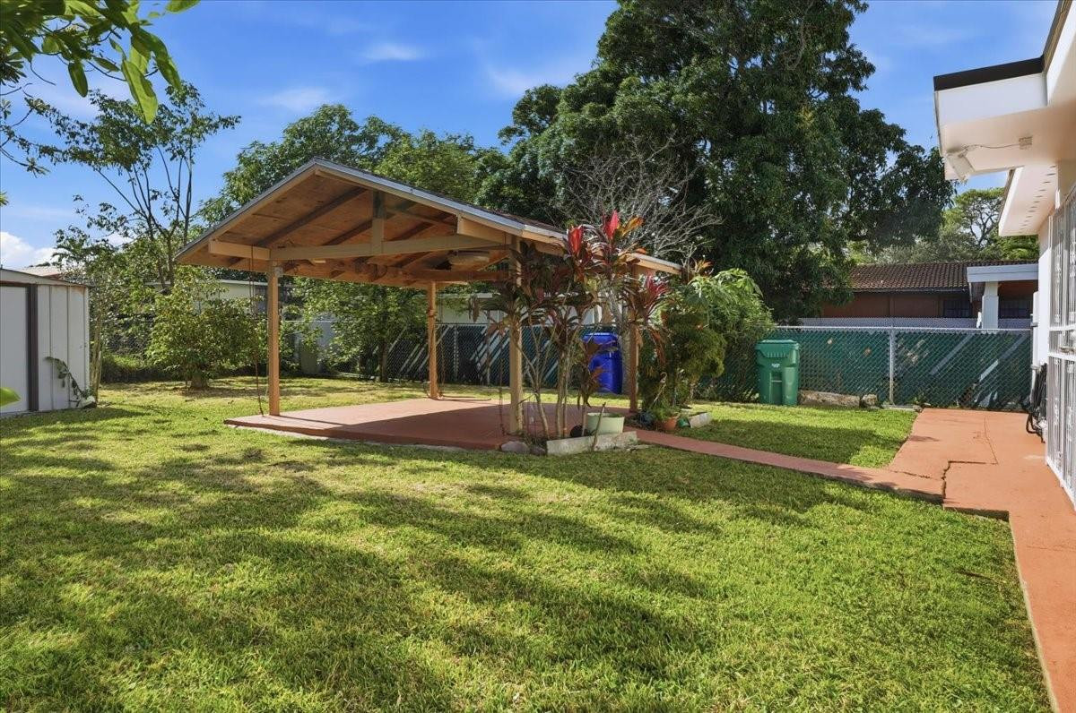 5580 Southwest 2nd Street Miami, FL 33134 - Photo 23 of 29 a view of a house with swimming pool and a yard