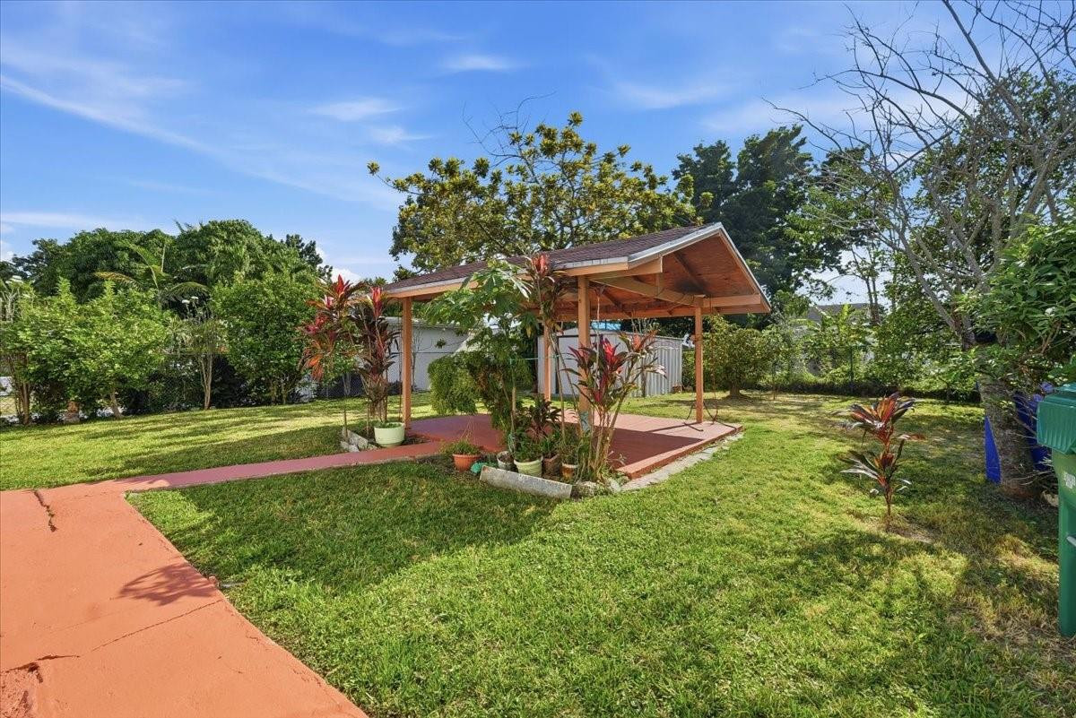 5580 Southwest 2nd Street Miami, FL 33134 - Photo 24 of 29 a view of a backyard with plants and a garden
