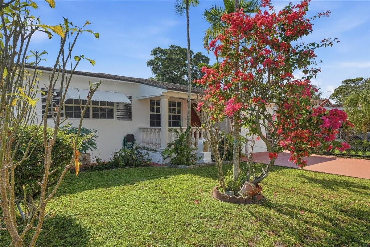 5580 Southwest 2nd Street Miami, FL 33134 - Photo 3 of 29 a front view of a house with a yard