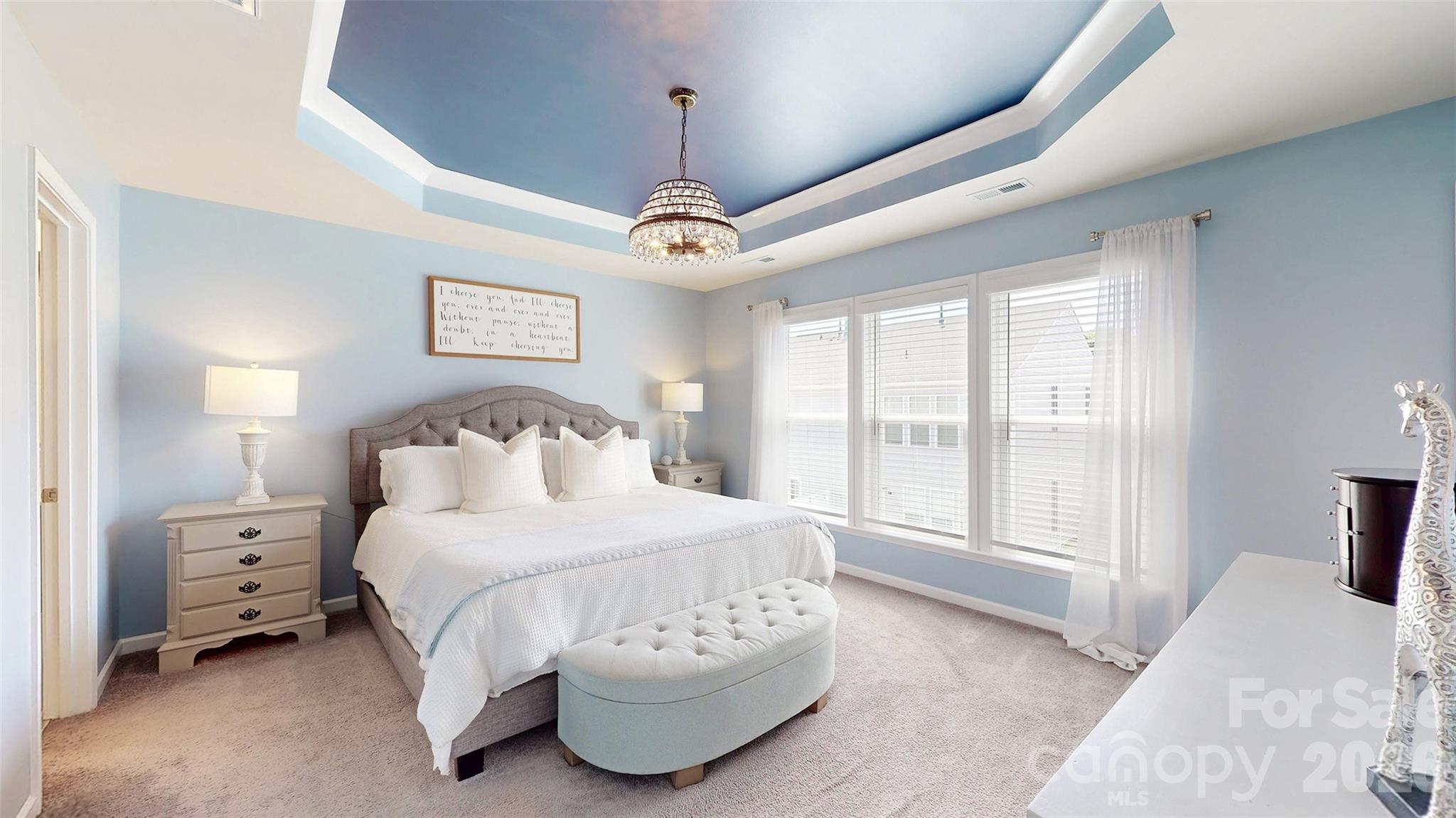 827 Canoe Song Road Fort Mill, SC 29708 - Photo 23 of 33 a bedroom with a large bed and a large window