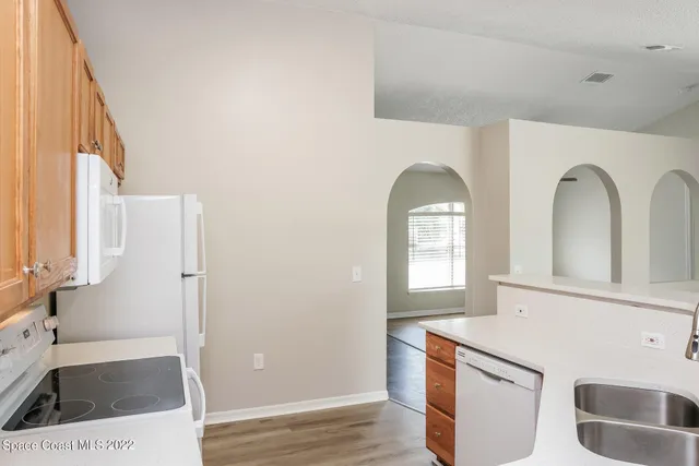 a view of a bathroom with bathtub and sink