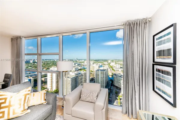 a gym with pool table and chairs