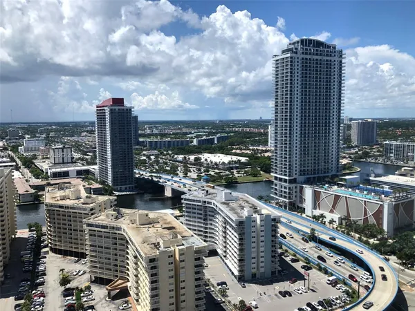 a bedroom with a large bed and a large window
