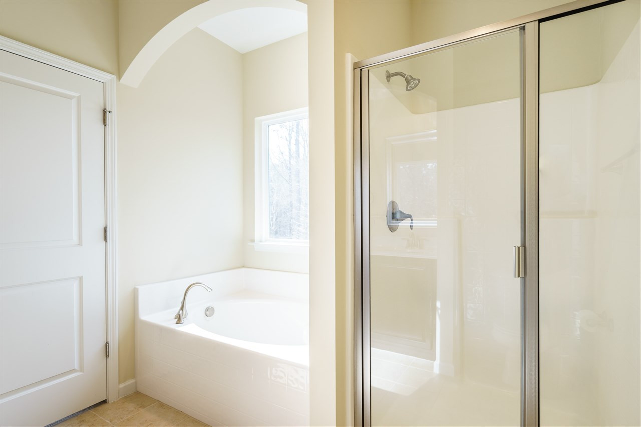 5635 Wade Park Boulevard Raleigh, NC 27607 - Photo 19 of 25 Enjoy this huge master bath with double vanity, garden tub, and separate shower. Master Bathroom