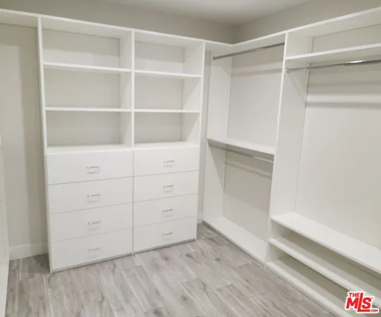 a view of an empty walk in closet