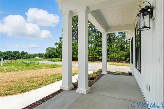 a view of a balcony with lake view and a floor to ceiling window