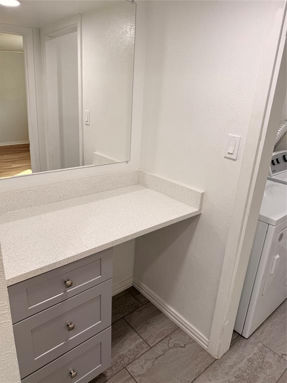 3925 Inwood Road, Unit 1017 Dallas, TX 75209 - Photo 14 of 23 a room with a wooden floor and cabinets