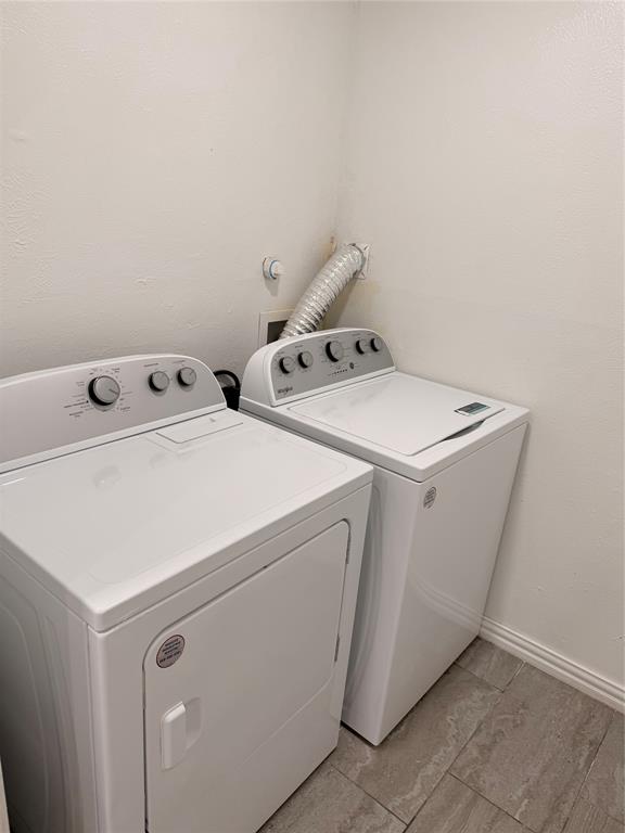 3925 Inwood Road, Unit 1017 Dallas, TX 75209 - Photo 15 of 23 a utility room with dryer and washer