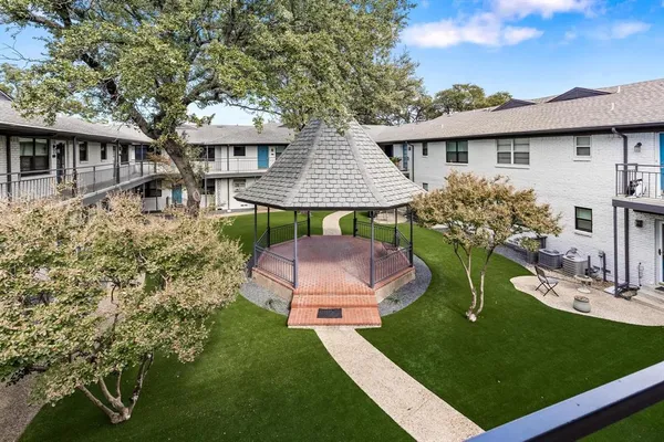 an aerial view of a house with swimming pool garden and patio
