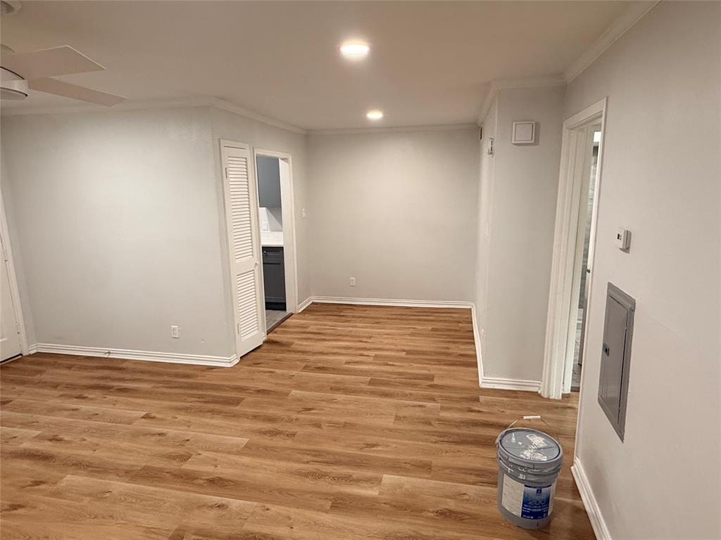 3925 Inwood Road, Unit 1017 Dallas, TX 75209 - Photo 5 of 23 a view of empty room with wooden floor and window