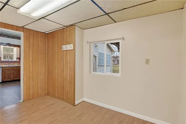 a view of a livingroom with a wooden floor and a window