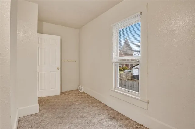 a view of an empty room with window