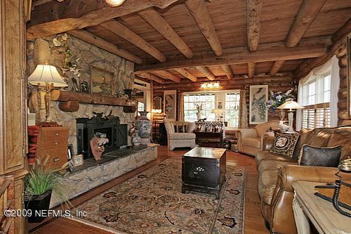 1270 Neck Road Ponte Vedra Beach, FL 32082 - Photo 3 of 18 a living room with furniture and a fireplace