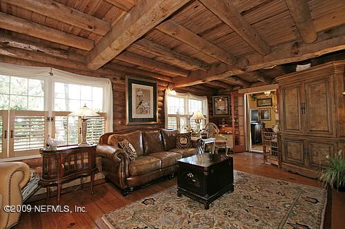 1270 Neck Road Ponte Vedra Beach, FL 32082 - Photo 4 of 18 a living room with furniture and a large window