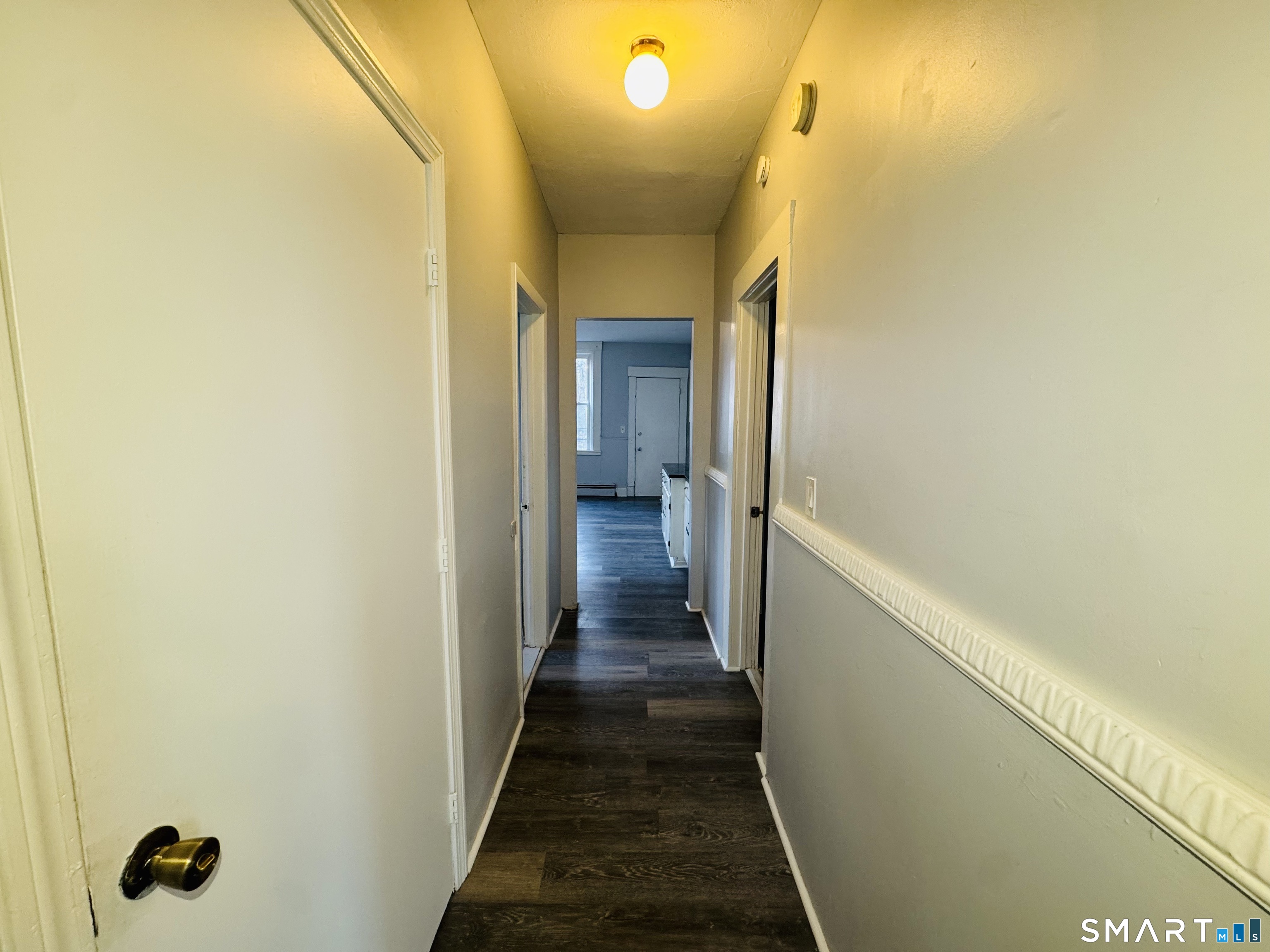 29 White Street, Unit 1 New Haven, CT 06519 - Photo 10 of 11 a view of a hallway with wooden floor