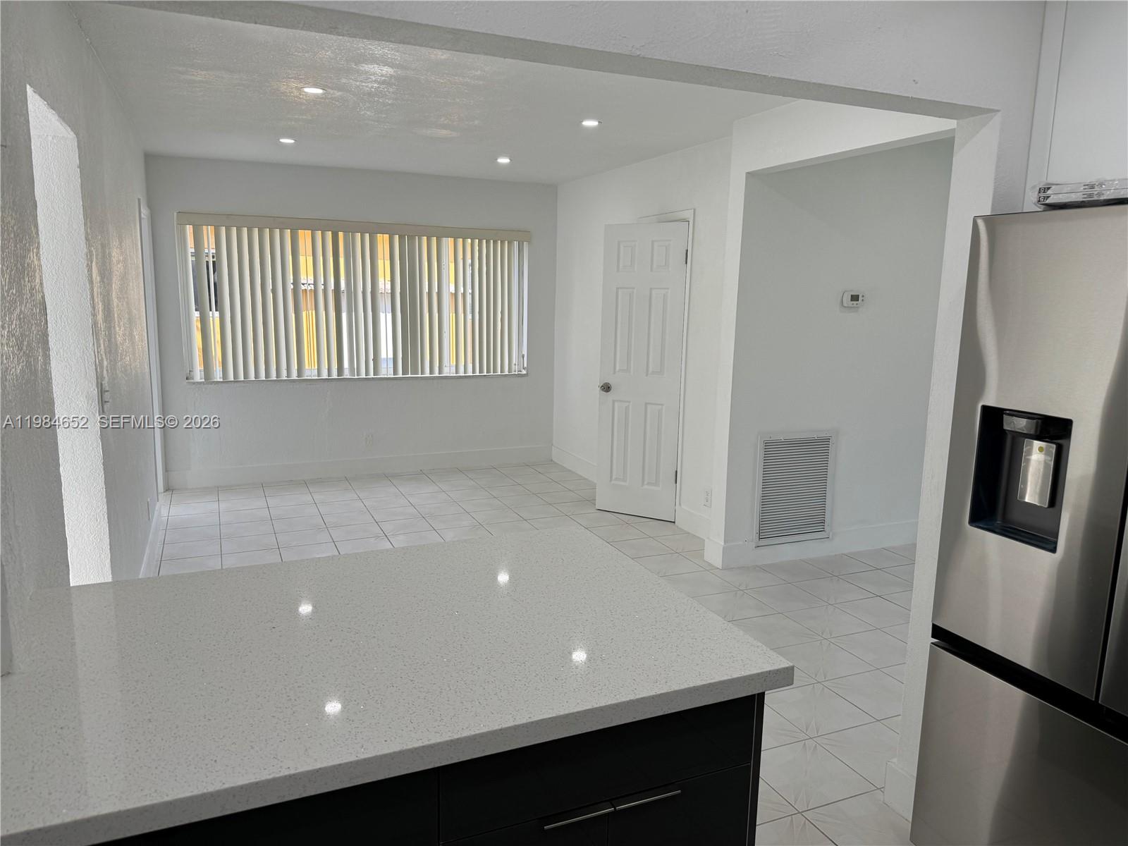 2400 North 57th Way Hollywood, FL 33021 - Photo 3 of 9 a view of an empty room with a window