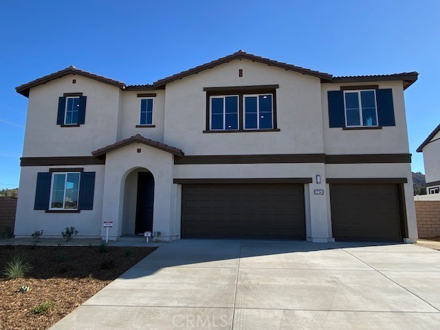a front view of a house with yard