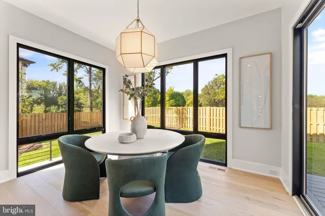 a bathroom with a sink vanity mirror and toilet