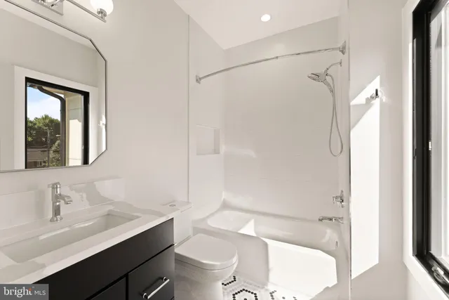 a kitchen with a sink cabinets and a window