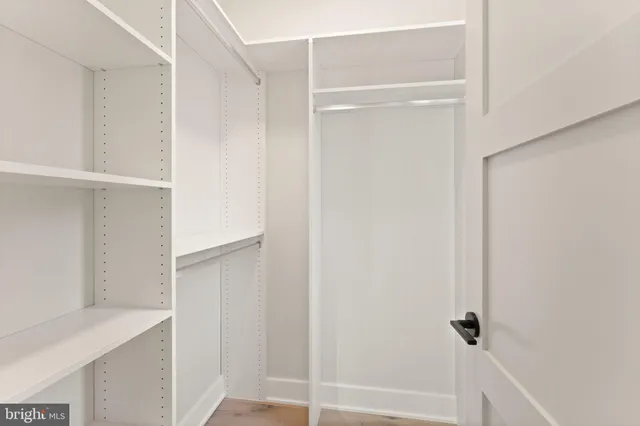 a kitchen with a sink appliances and cabinets