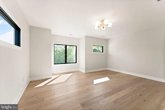 a bed room with a bed and a window