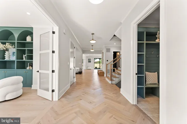 a bedroom with furniture and a large window