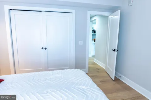 a bathroom with a sink shower and a mirror