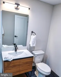 a bedroom with a bed and a rug