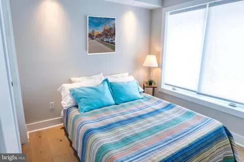 a bathroom with a sink toilet vanity and bathtub